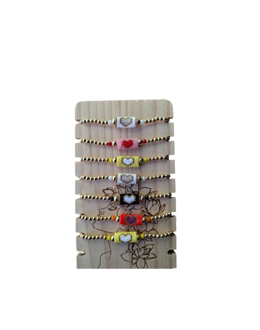 Pulseras de cuentas tejidas formando un corazón 