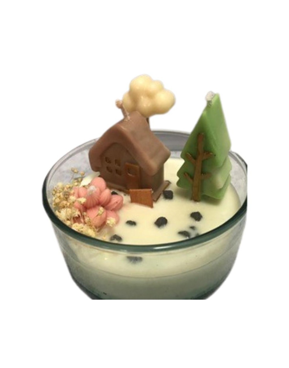 vela en envase de vidrio con figuras