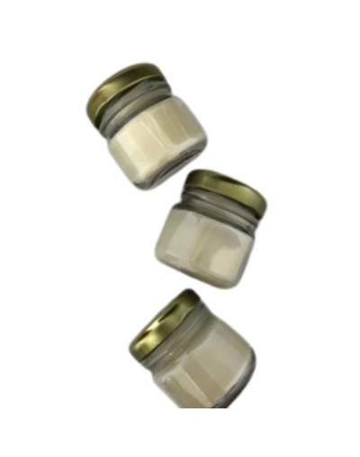 vela en envase de vidrio compotero con tapa