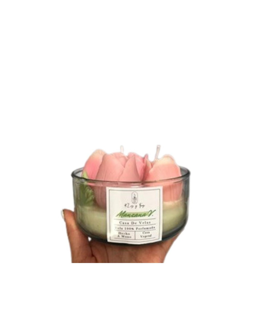 vela en envase de vidrio con figuras