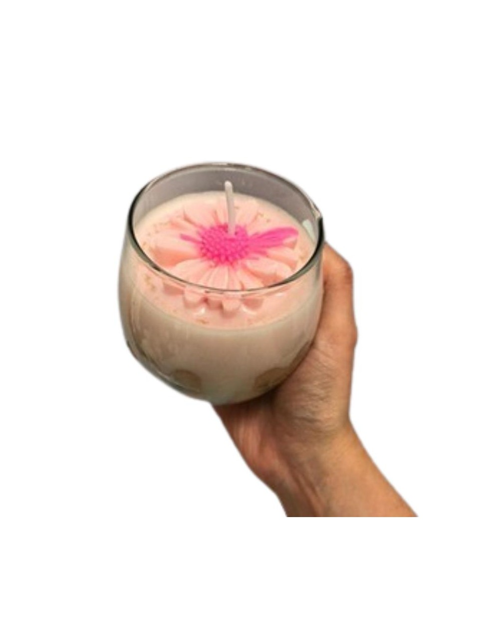 vela en envase de vidrio con figuras