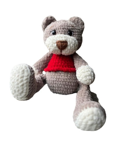 Oso tejido a mano en técnica amigurumi, elaborado con material afelpado de alta calidad que le brinda una textura suave y agrada