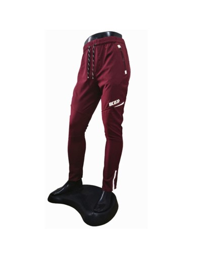 Pantalón deportivo cortavientos hombre multideporte bordó