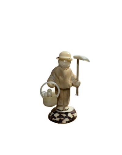 Artesania campesino tallado en tagua