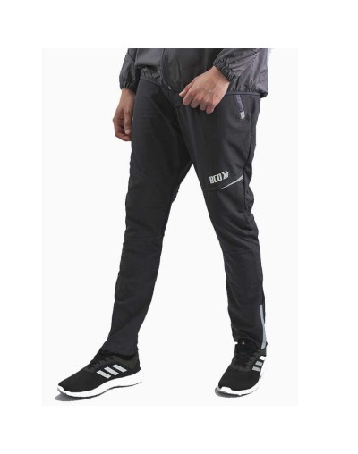 Pantalón deportivo cortavientos hombre multideporte gris ratón