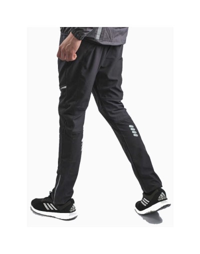 Pantalón deportivo cortavientos hombre multideporte gris ratón