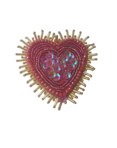 Broche corazón resplandor